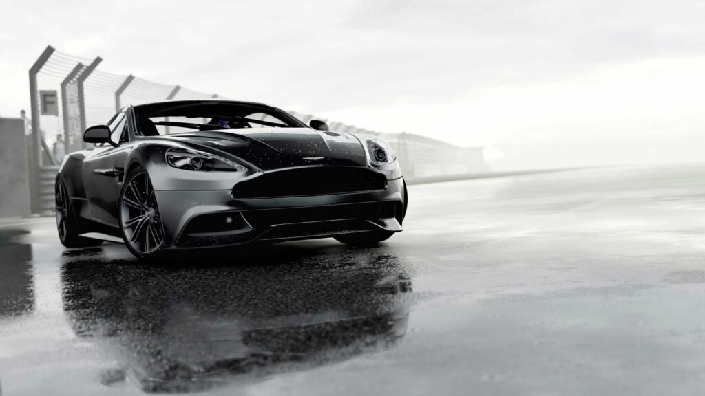 Sleek Aston Martin Sports Car on Wet Racetrack - High-Res Wallpaper