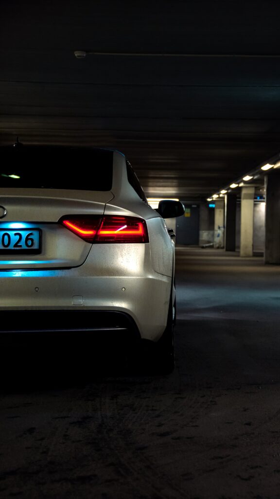 Sleek Audi A5 Rear View in Dim Garage - Stunning Taillights Focus Wallpaper