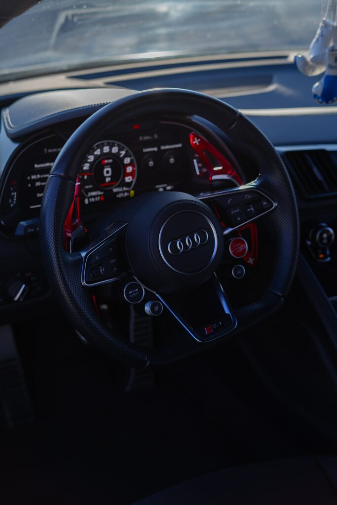 Sleek Audi Interior Wallpaper: Modern Steering Wheel Design