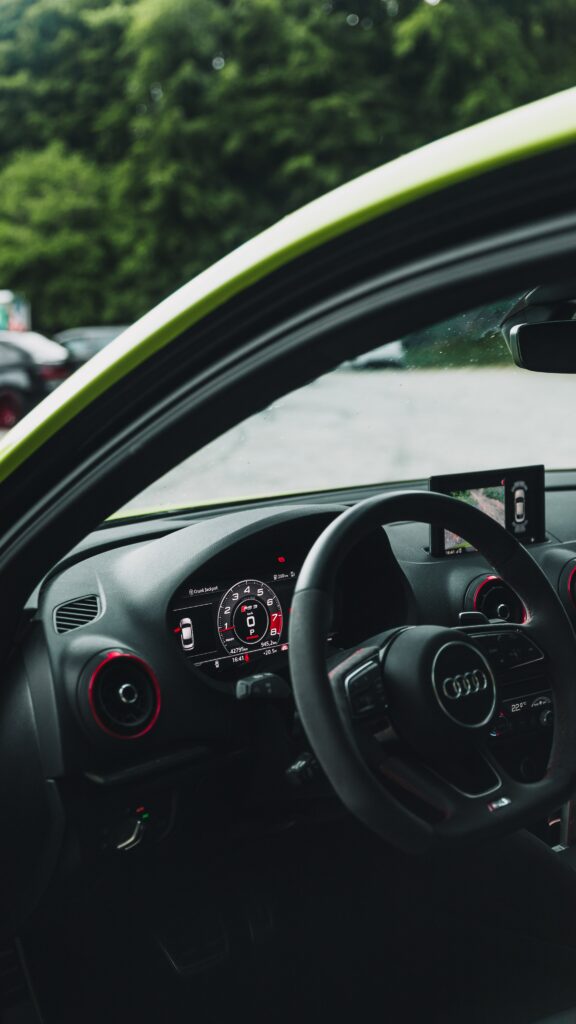 Modern Audi Interior Wallpaper: Steering Wheel & Digital Speedometer