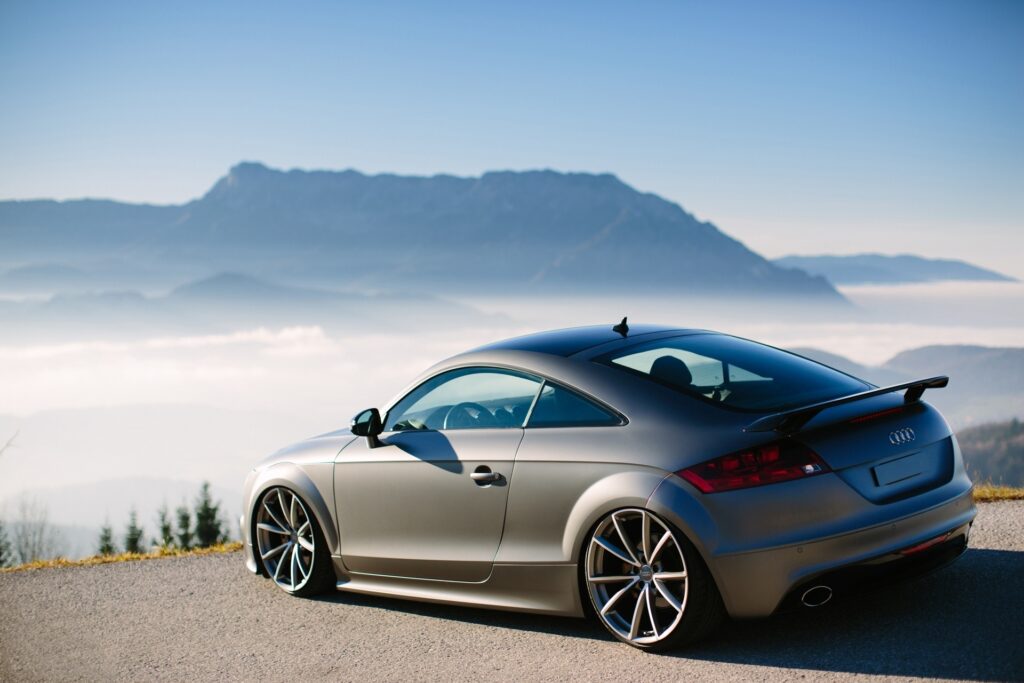 Sleek Audi TT in Misty Austrian Mountains - Stunning Wallpaper