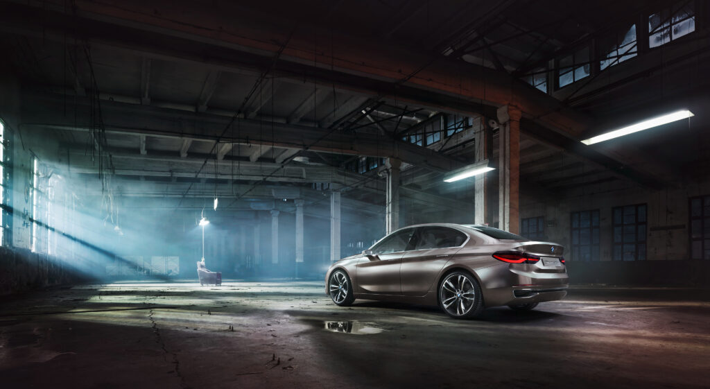 Sleek BMW Concept Car in Dimly Lit Industrial Wallpaper