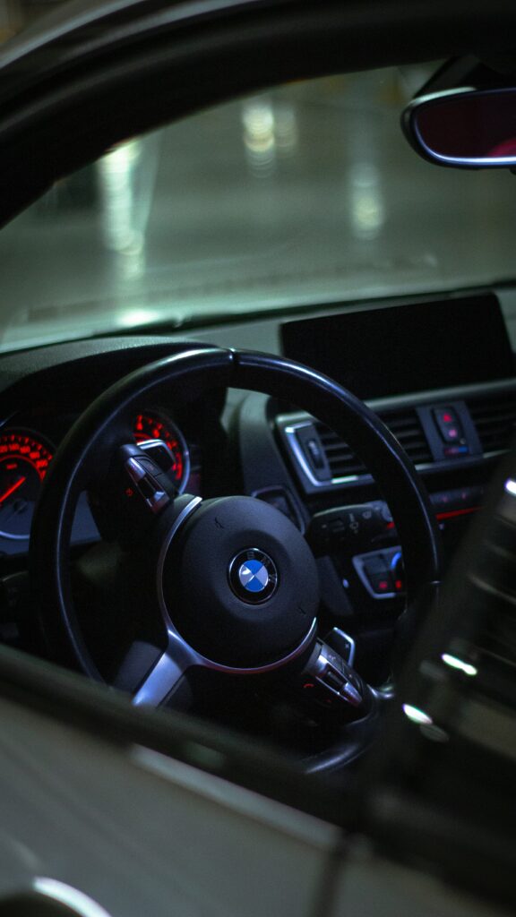 Modern BMW Interior: Sleek Dashboard & Illuminated Speedometer Wallpaper