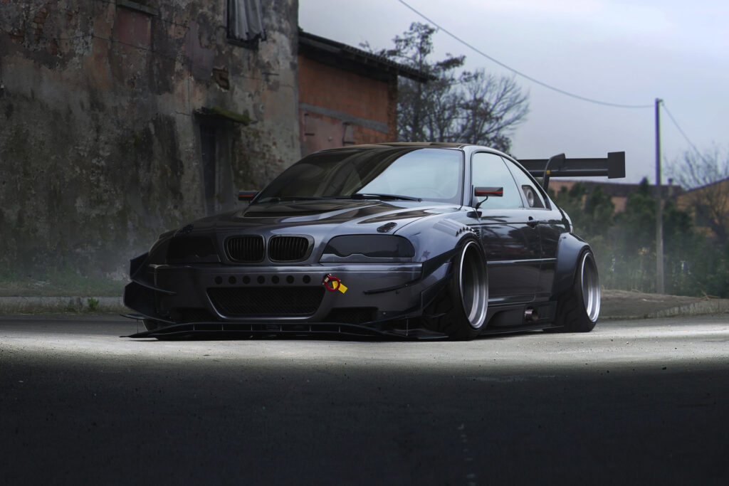 Stunning Side View of BMW M3 E46 Against Urban Background Wallpaper
