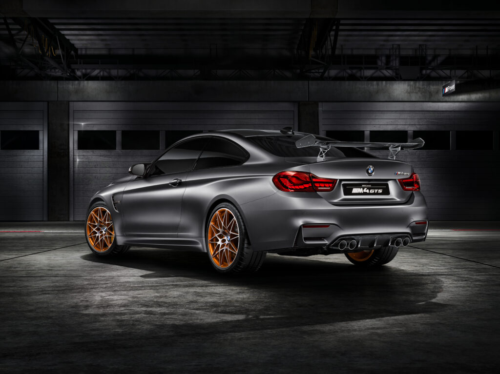 Stunning Silver BMW M4 GTS (F82) Rear View in Dim Garage Wallpaper