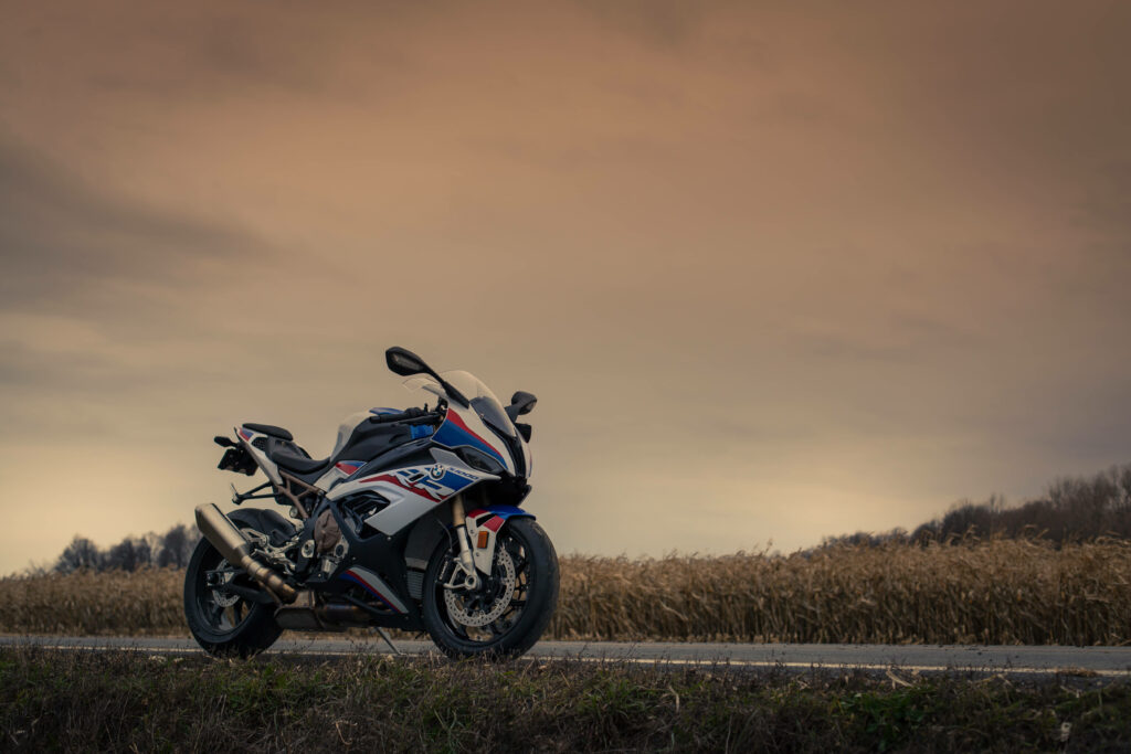 Stylish BMW Motorcycle Wallpaper in Blue, Red & White Countryside