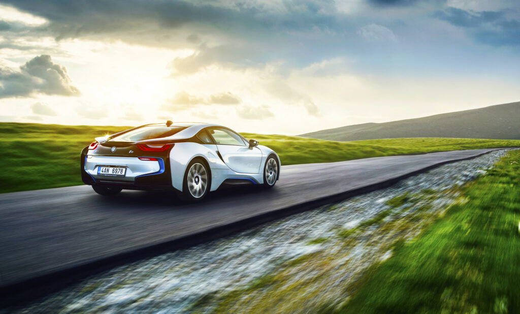 Dynamic BMW i8 Wallpaper: Speed Meets Scenic Elegance