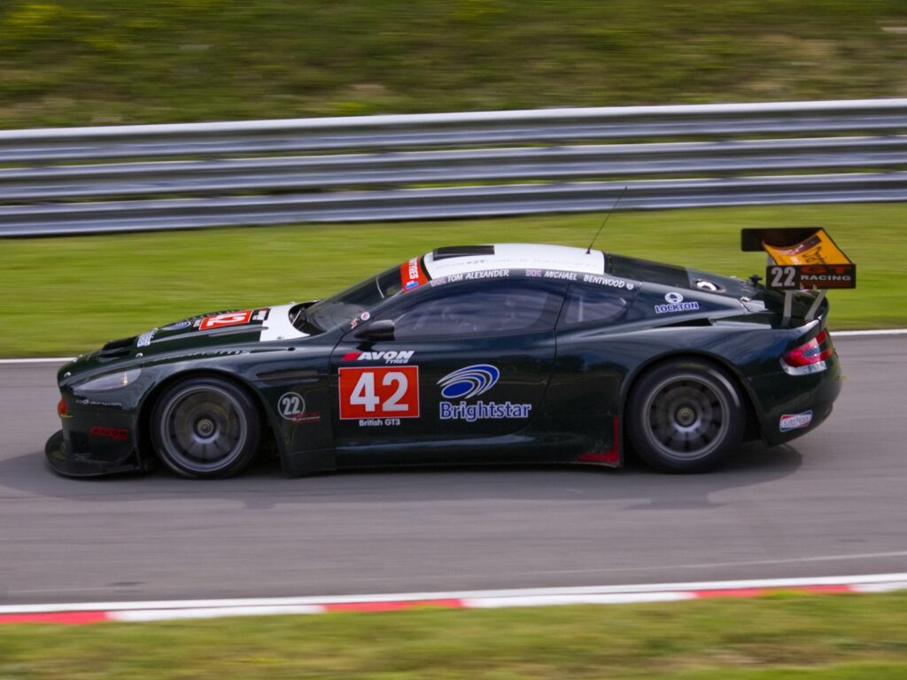 Sleek Black 2005 Aston Martin DBRS9: Racing Elegance Wallpaper
