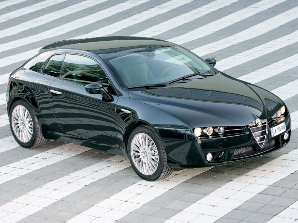 Sleek black Alfa Romeo Brera on modern tiled surface showcasing elegant sporty design wallpaper