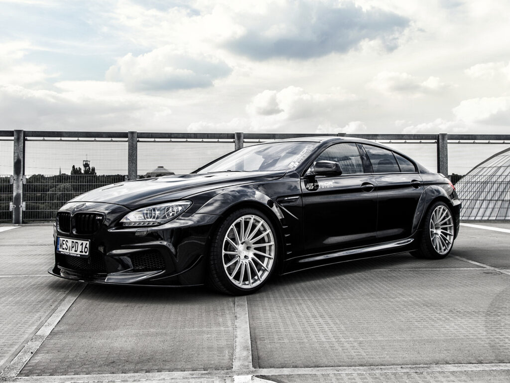Sleek Black BMW M6 with Prior-Design Kit on Rooftop - Stunning View Wallpaper