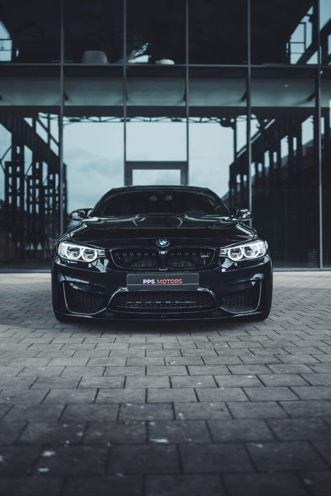 Sleek Black BMW Front View Wallpaper - Urban Elegance Background