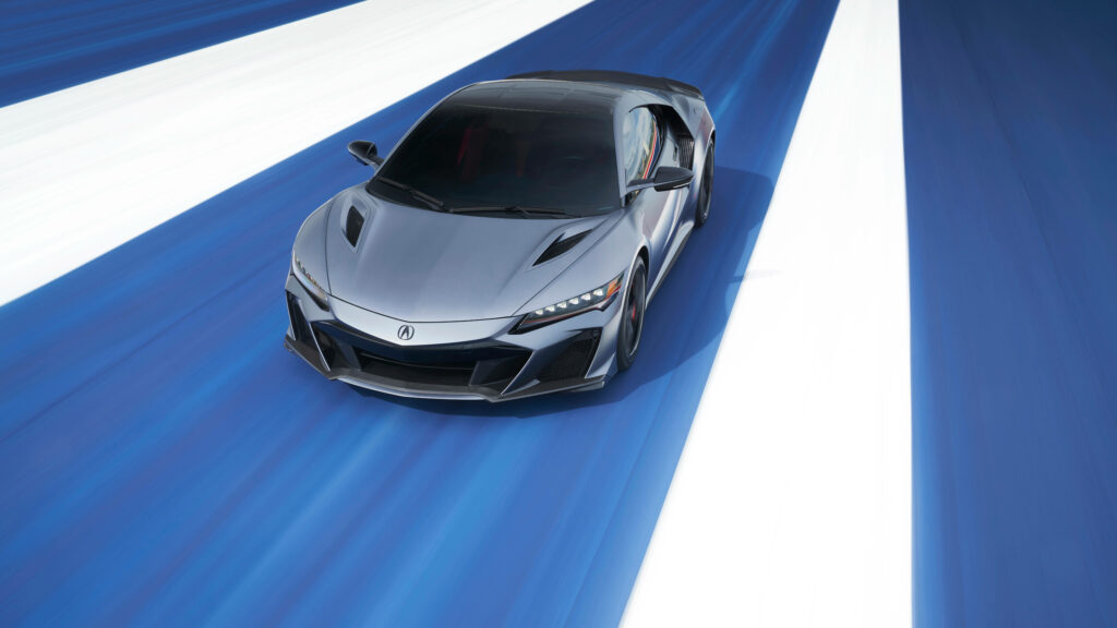 Sleek black car racing on vibrant blue and white dynamic road modern design 4k wallpaper