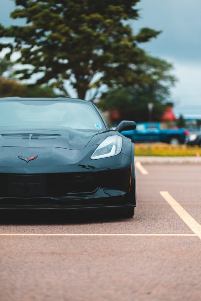 Sleek Black Chevrolet Corvette: Front View Wallpaper with Dynamics