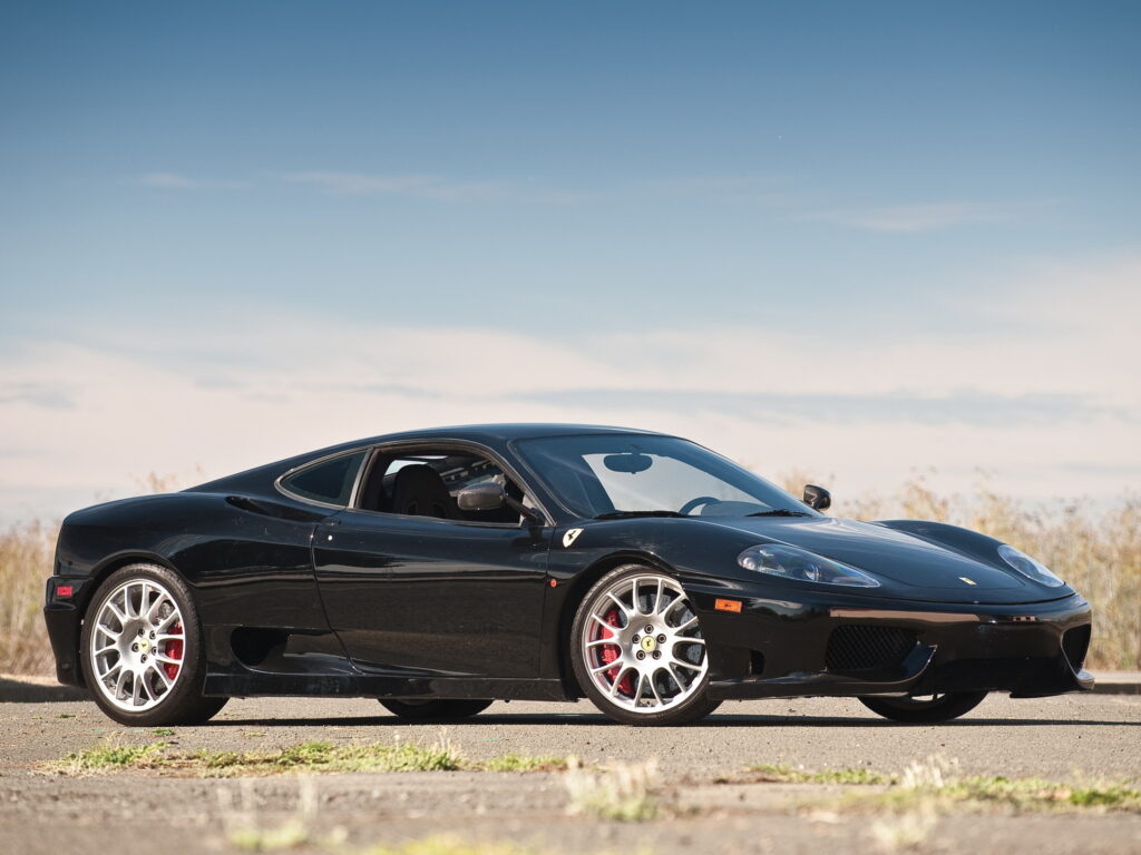 Sleek Black Ferrari 360 Challenge Stradale Side View Wallpaper