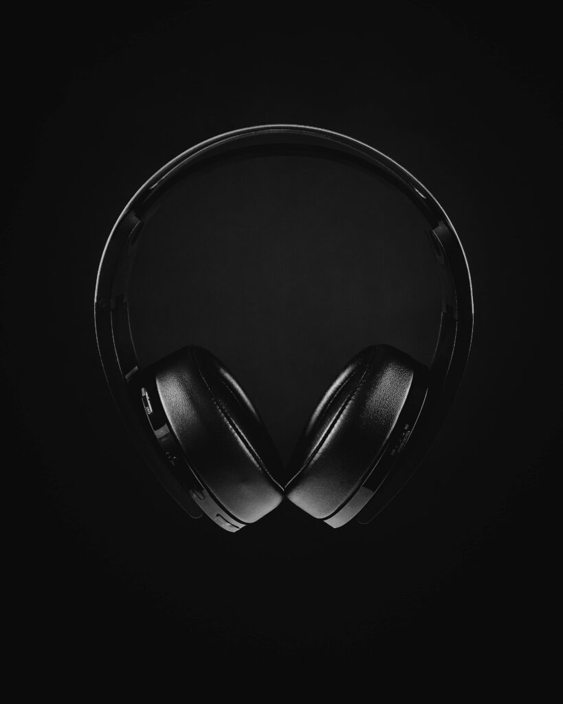Sleek Black Headphone Wallpaper: Modern Audio Experience Background