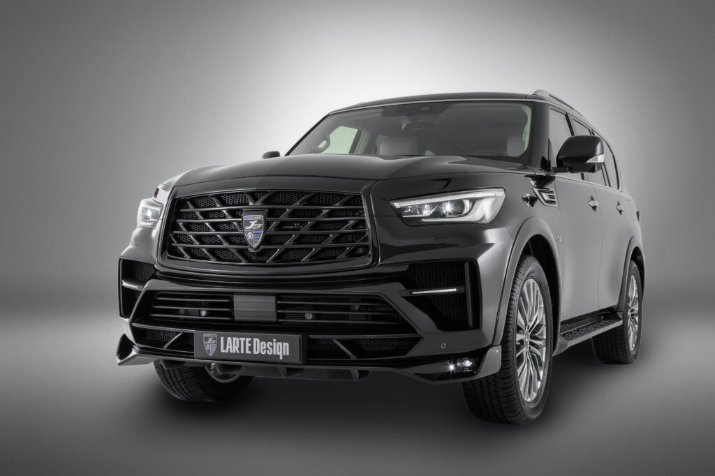Sleek Black Infiniti QX80: Luxurious Design & Prominent Headlight Wallpaper