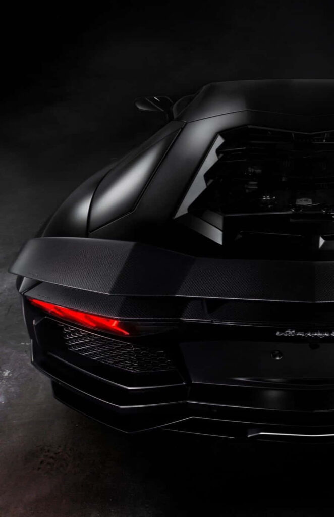 Black Lamborghini rear view with red tail light sleek design iPhone wallpaper background