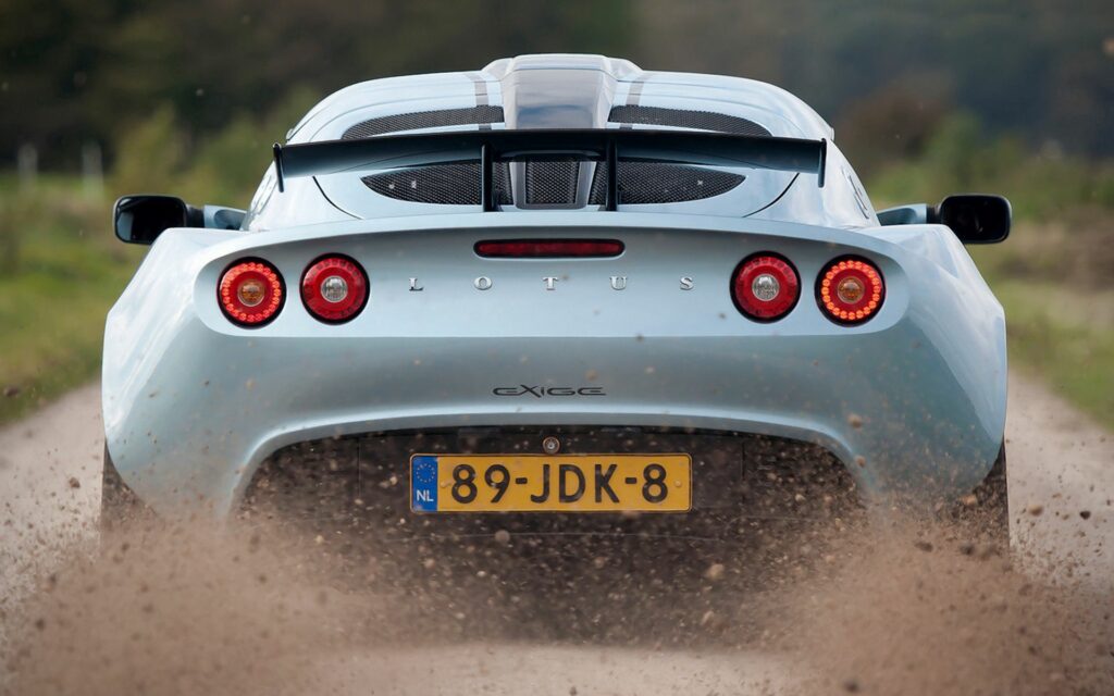 Dynamic Black Lotus Exige Rear View Wallpaper: Sleek Design in Motion