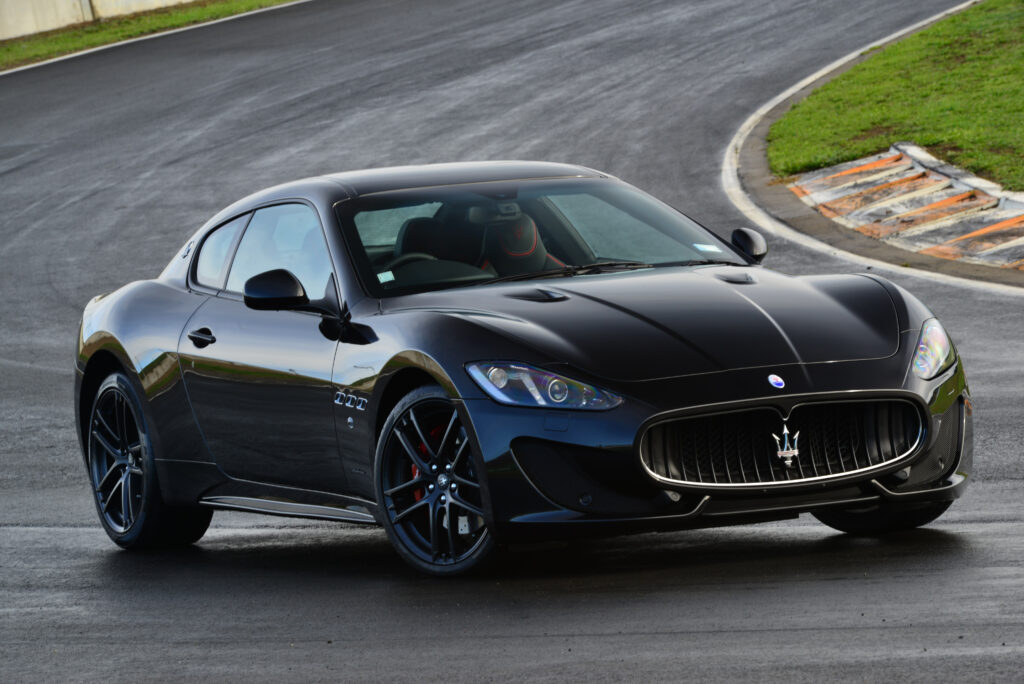 Sleek Black Maserati GranTurismo MC Sportline Side View Wallpaper