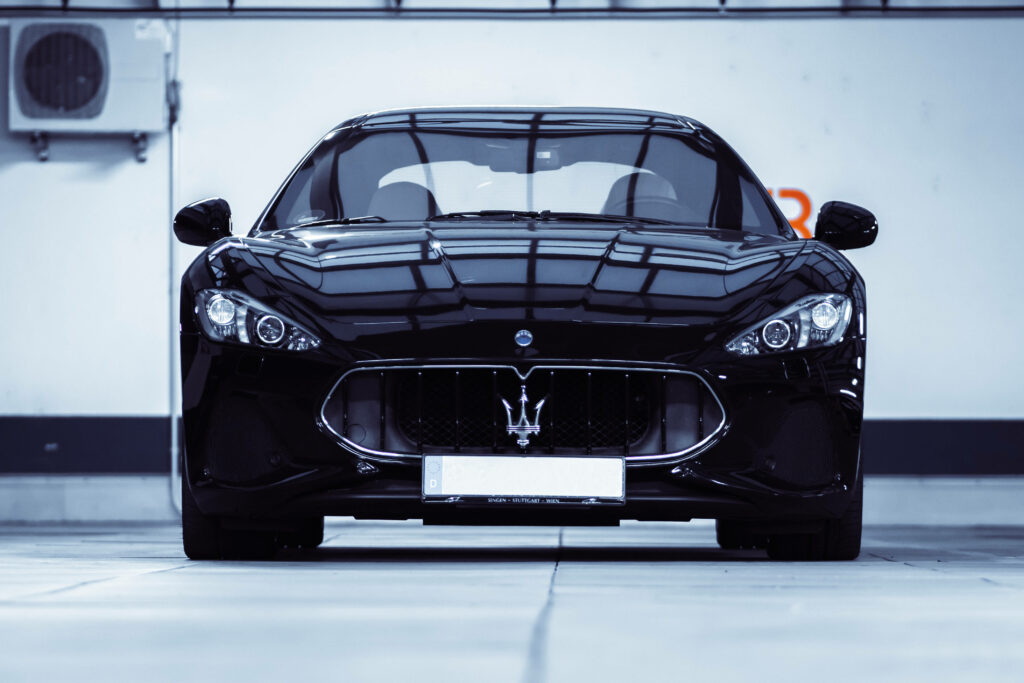 Sleek Black Maserati Wallpaper: Luxurious Design & Glossy Finish