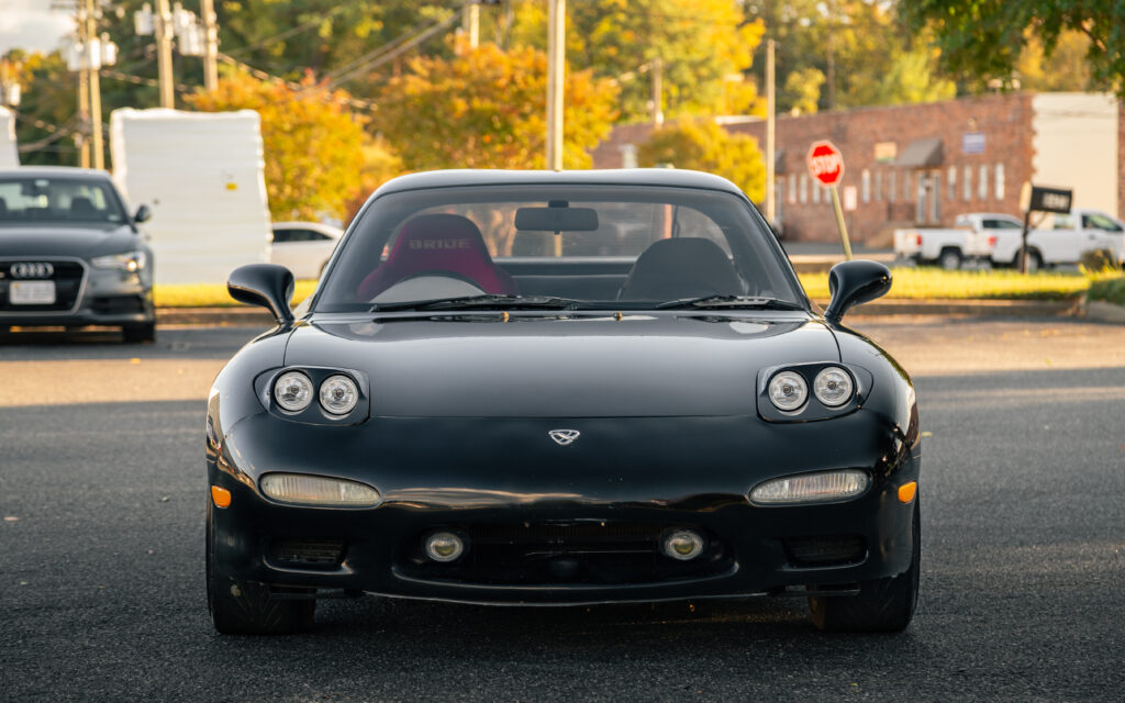 Sleek Black Mazda RX-7 Wallpaper: Stunning Front View & Design