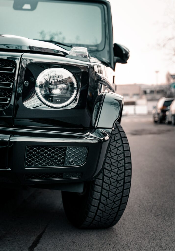 Sleek Black Mercedes G-Class: Iconic Design & Urban Background Wallpaper
