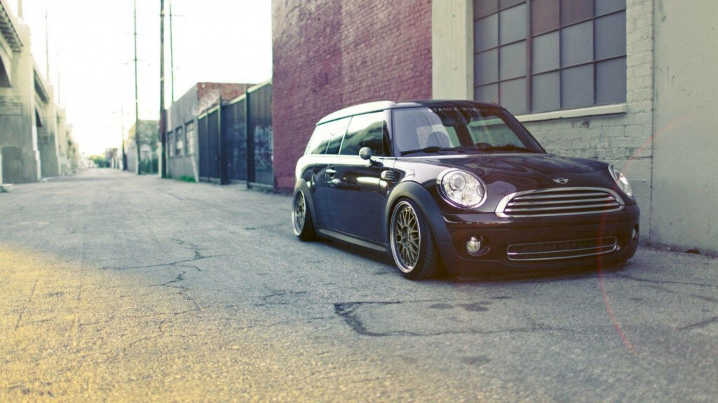 Sleek Black Mini Cooper R53: Urban Alleyway Wallpaper Background