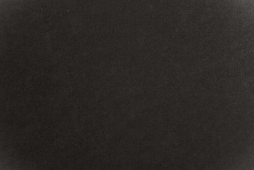 Sleek Black Paper Texture Background - Elegant Wallpaper Design