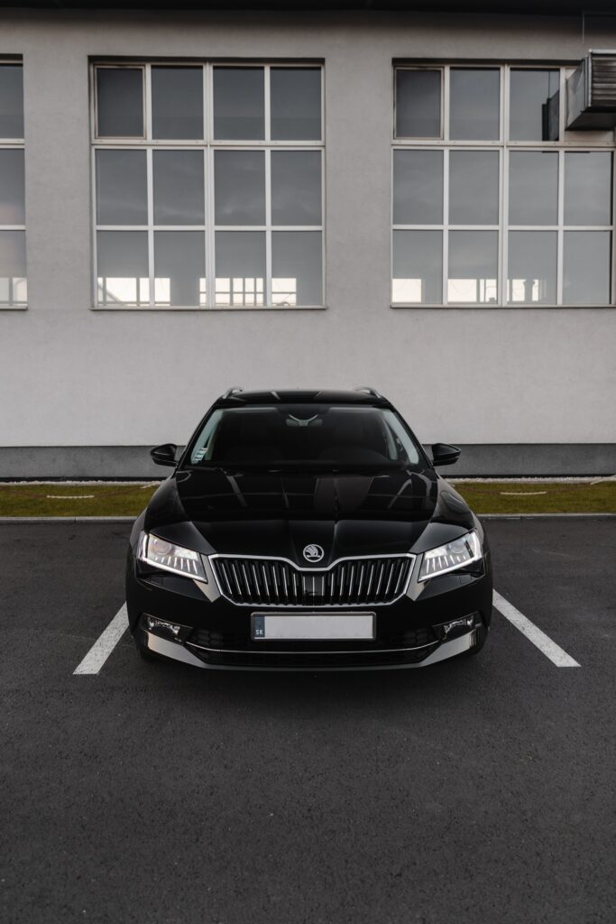 Stylish Black Skoda Superb 3 Front View Wallpaper with Modern Design
