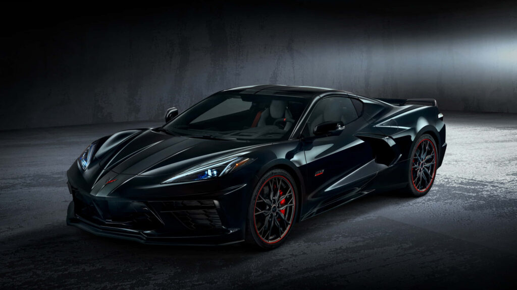 Sleek black sports car in dim modern setting highlighting aggressive design and style wallpaper