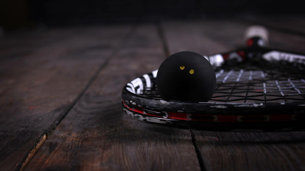 Minimalist Black Squash Racket & Ball on Rustic Wood Wallpaper
