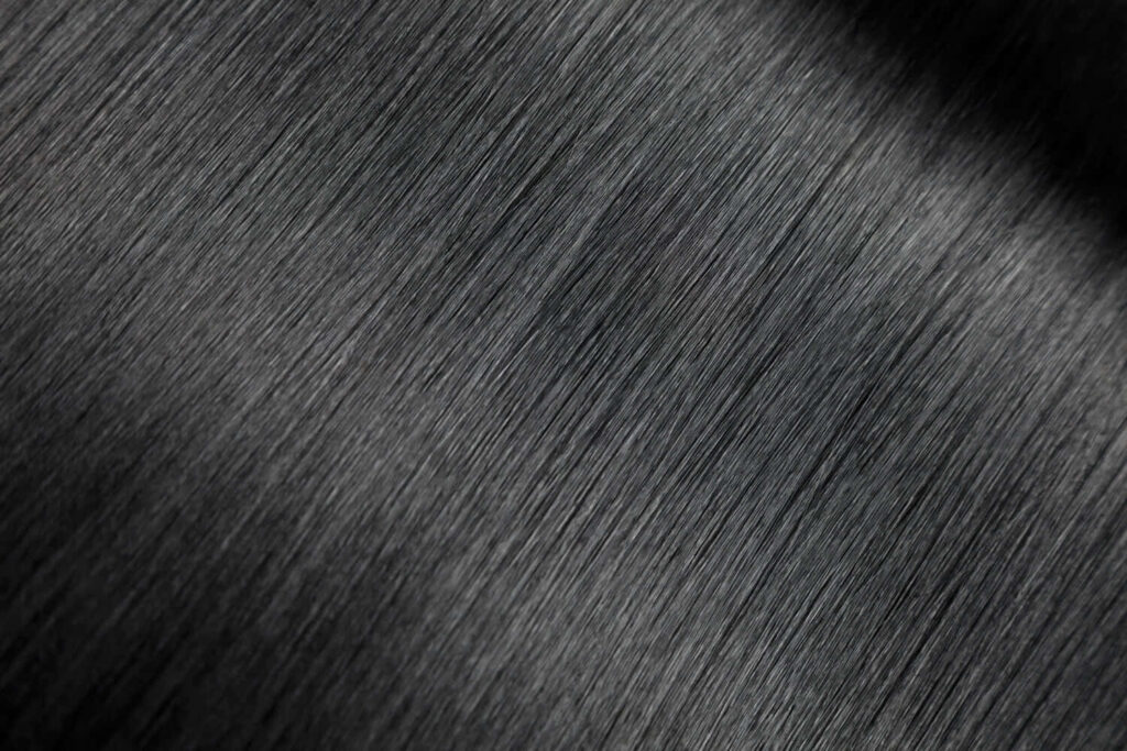 Sleek Black Textured Hair Closeup - Glossy Wallpaper Background
