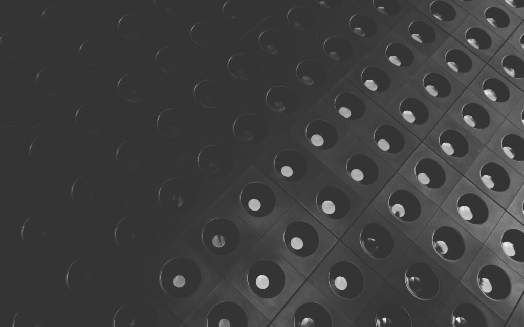 Modern Black Wallpaper with Geometric Circular Indents - Stylish Background