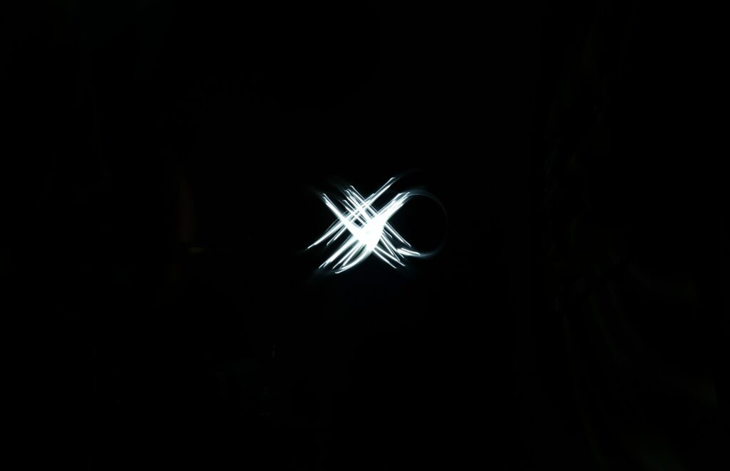 Futuristic Black Wallpaper with Luminous Intersecting Lines