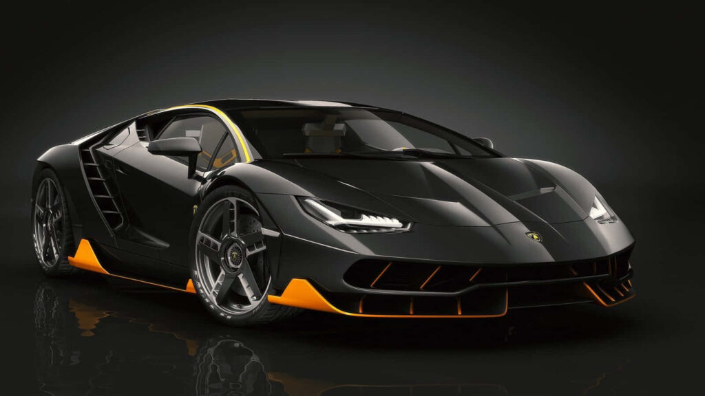 Sleek black orange sports car with aerodynamic design on dark high performance wallpaper background