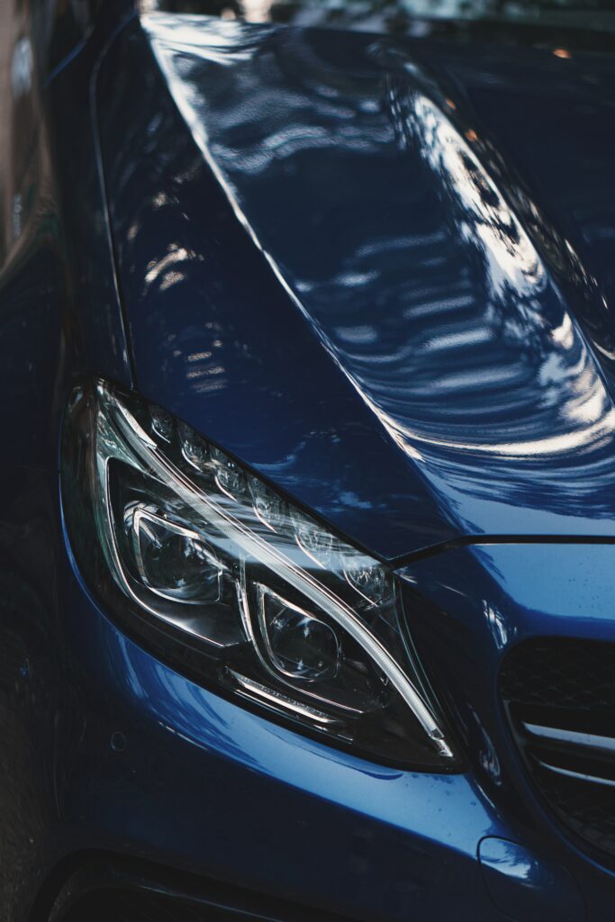 Sleek Blue Car Wallpaper: Modern Headlight Design & Elegant Features