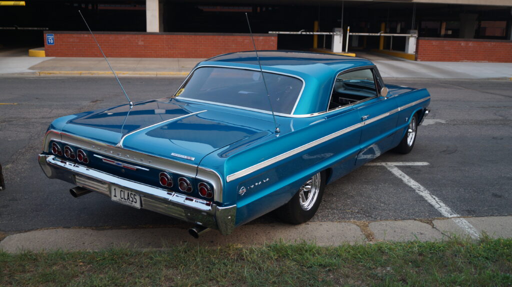 Stunning Blue Chevrolet Impala Wallpaper: Retro Design & Urban Backdrop