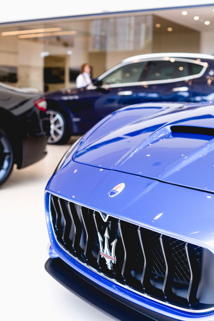 Vibrant Blue Maserati Wallpaper: Iconic Grille & Luxurious Detail