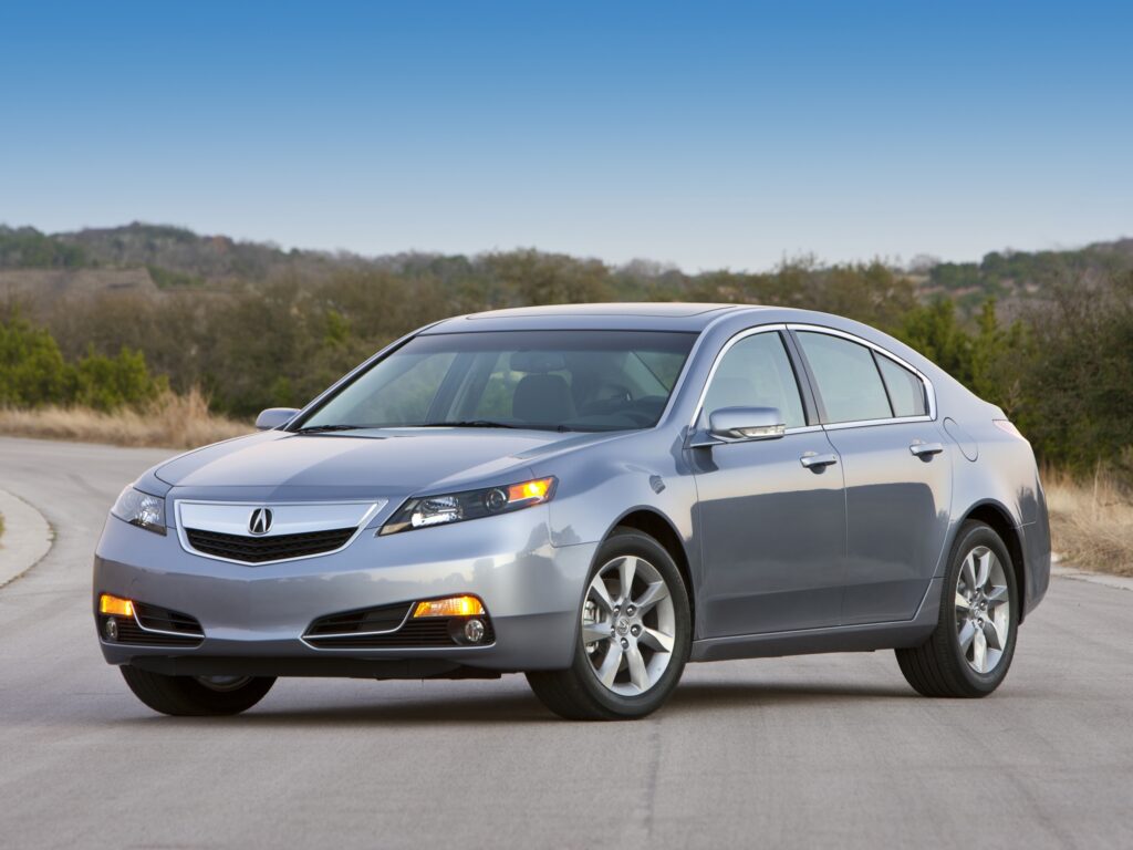 Side View of Sleek Blue Metallic 2011 Acura TL in Nature Background Wallpaper
