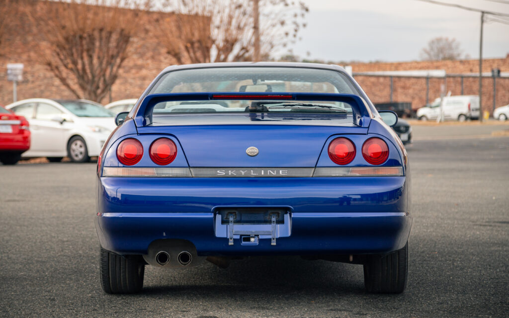 Sleek Blue Nissan Skyline R33 Wallpaper with Iconic Taillights