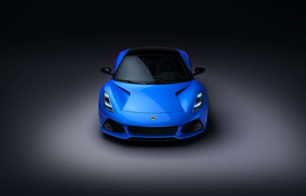 Blue modern sports car with sleek aerodynamic design on dark background wallpaper