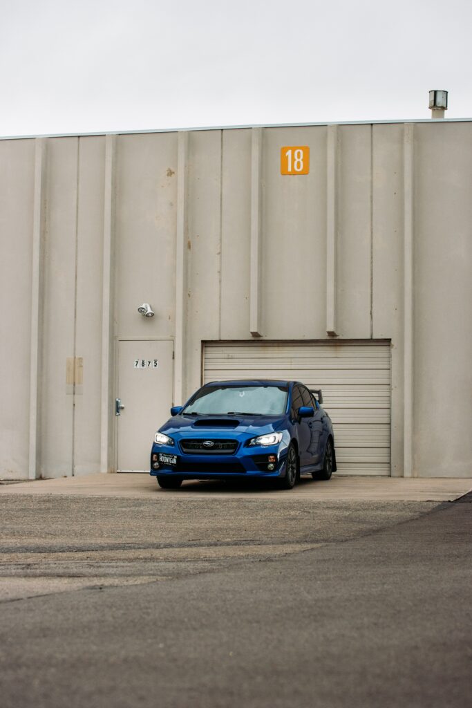 Blue Subaru Car Wallpaper: Sleek & Sporty in Urban Setting