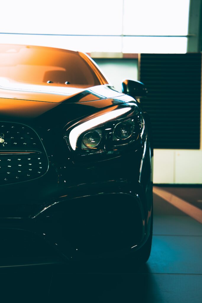 Stylish Car Wallpaper: Modern Headlights with Dramatic Glare