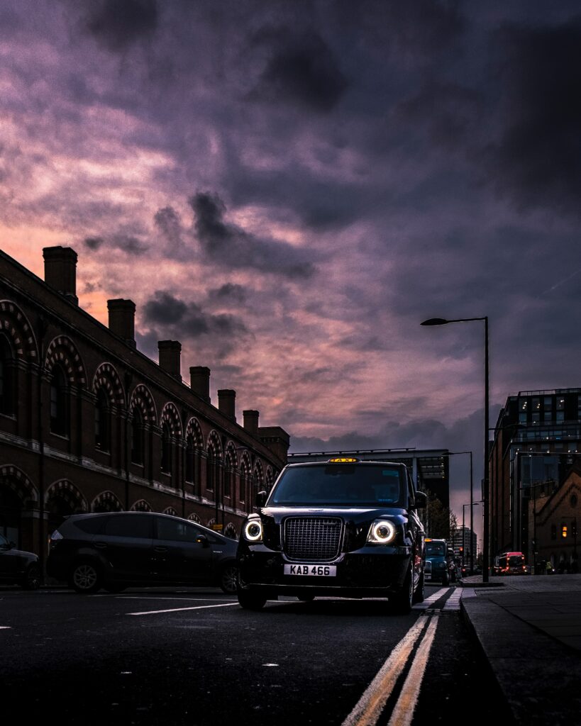 Sleek Car Front View in Urban Setting - Elegant Wallpaper