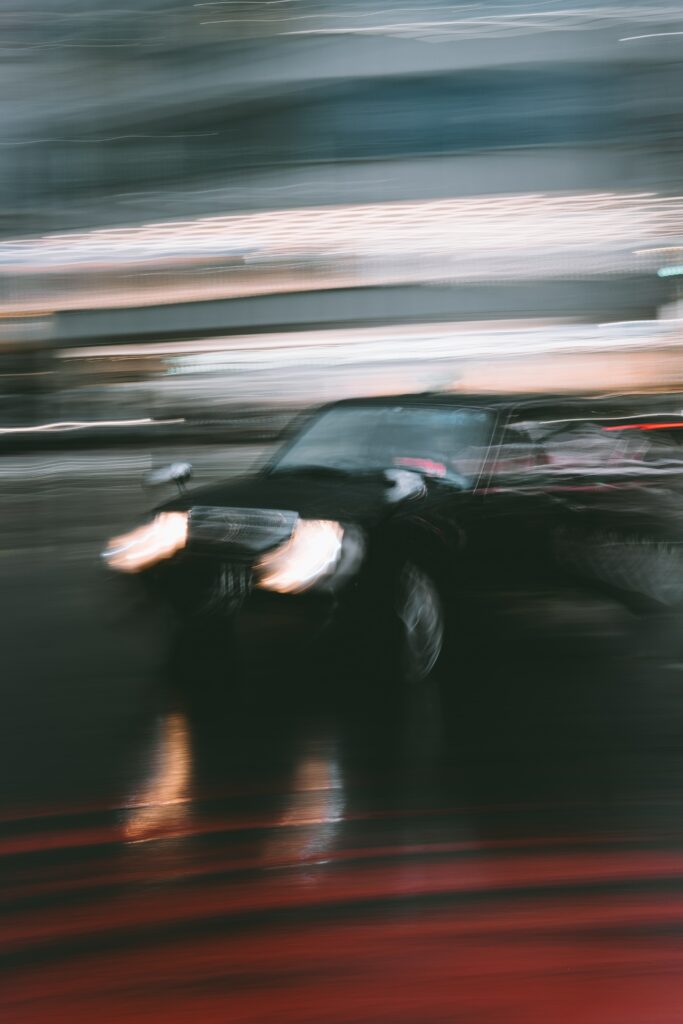 Sleek Car in Motion Wallpaper - Dynamic Night Urban Blur