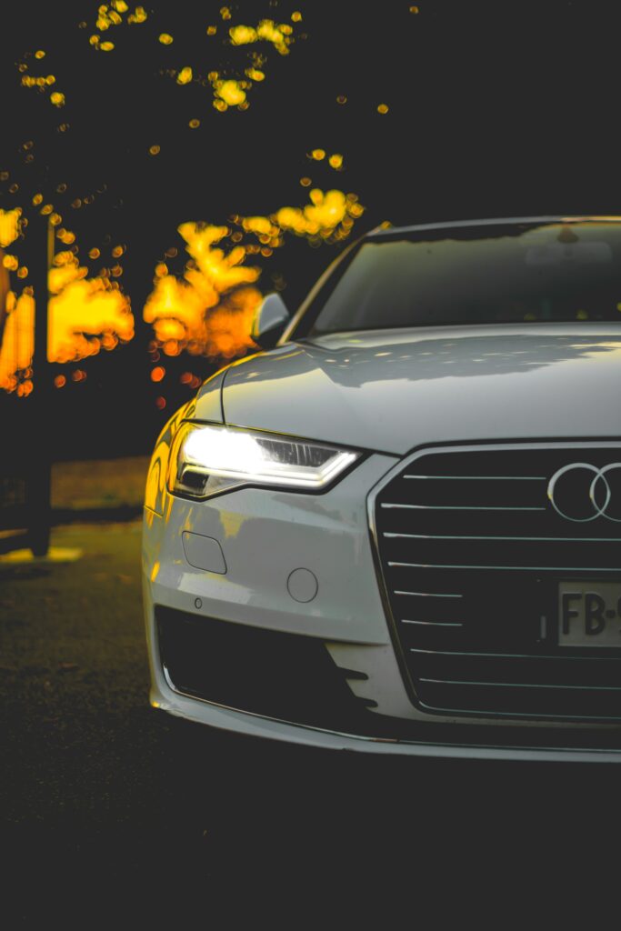 Sleek Car in Motion with Dynamic Blur & Sunset Glow Wallpaper