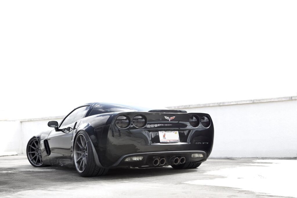 Chevrolet Corvette Z06: Iconic Sports Car Against Minimalist Background Wallpaper
