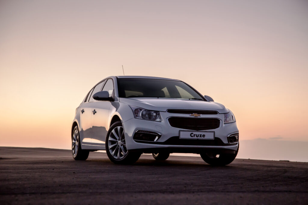 Sleek Chevrolet Cruze Hatchback at Sunset – Elegant Automotive Design Wallpaper