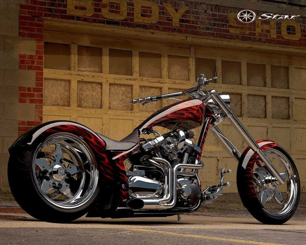 Vibrant Chopper Motorcycle Wallpaper in Rustic Garage Setting