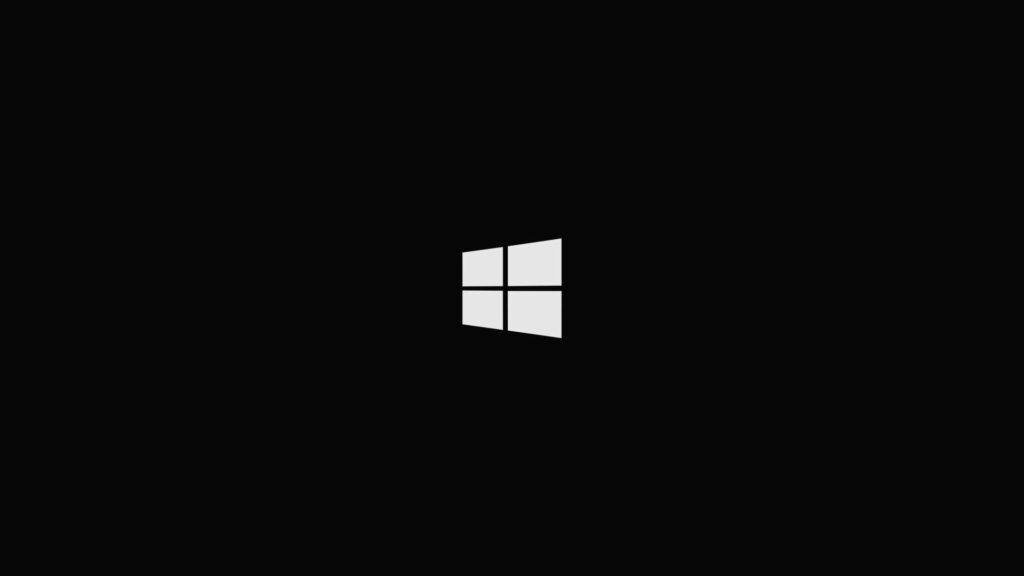 Sleek and Minimalist Windows 10 HD Wallpaper with White Logo on Black Backdrop - Perfect for Desktop Backgrounds
